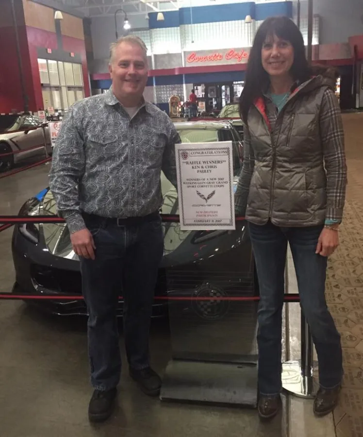 Ken and Chris Pauley taking delivery of car 043, the National Corvette Museum's raffle car, at the museum.